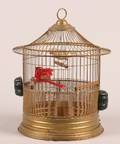 A Gilt Metal Birdcage With Two Birds