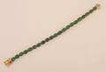 A Ladys Yellow Gold and Emerald Bracelet