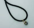 A Ladys 18 Karat Yellow Gold Black Tahitian Pearl and Diamond Pendant
