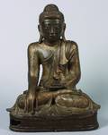 A Burmese Mandalay Style Gilt Bronze Figure of a Seated Buddha