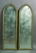 A Pair of Parcel Gilt and Painted Gothic Style Mirrors