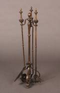 A Bronze Three Piece Set of Fireplace Tools