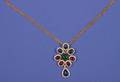 A Ladys 18 Karat Yellow Gold Blue Sapphire Ruby Emerald and Diamond Pendant Trio