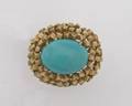 A Ladys 14 Karat Yellow Gold and Turquoise Ring
