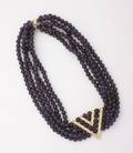A Ladys Five Strand Amethyst Bead Necklace with an 18 Karat Yellow Gold and Diamond Centerpiece