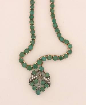 A Ladys Yellow Gold Emerald and Diamond Necklace Earring and Ring Set