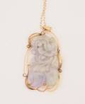 A Yellow Gold and Jadeite Carving Pendant