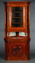 An Eastlake Carved Walnut Corner Cabinet