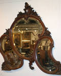 A Carved Mahogany Rococo Style Mirror