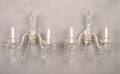 A Set of Four Cut and Molded Two Light Sconces