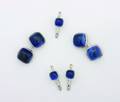 A Gentlemans 14 Karat White Gold and Synthetic Blue Sapphire Cabochon Five Piece Dress Set