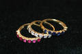 A Group of Three 14 Karat Yellow Gold Ruby Sapphire and Diamond Rings