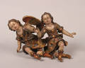 A Pair of Continental Polychrome and Gilt Ceramic Angels