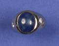 A Gentlemans 14 Karat White Gold Blue Star Sapphire and Diamond Ring