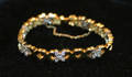 A Ladys Yellow and White Gold and Diamond Bracelet