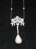 A Ladys White Gold Diamond Mabe and Cultured Pearl Necklace