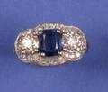 A Ladys Platinum Diamond and Synthetic Blue Sapphire Ring