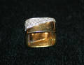 An 18 Karat Yellow Gold and 14 Karat White Gold and Diamond Ring