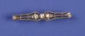 A Ladys Platinum and Diamond Filigree Bar Pin