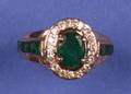 A 14 Karat Yellow Gold Emerald and Diamond Ring