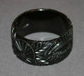 A Ladys Carved Black Bakelite Bangle Bracelet
