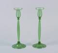 A Pair of Steuben Green Glass Candlesticks