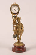 A Gilt Bronze German Mystery Table Clock by Junghans