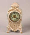 An Eight Day Time and Strike French Porcelain Mantel Clock