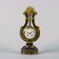 An Eight Day Time and Strike French Sevres Lyre Mantel Clock