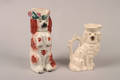 Two Staffordshire Spaniel Form Pitchers