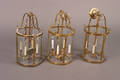 A Set of Three Four Light Brass Hanging Lanterns