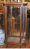A Louis XV Style Mahogany Bowfront Vitrine
