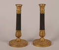 A Pair of Empire Style Gilt and Patinated Bronze Candleholders
