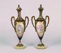 A Pair of Sevres Style Porcelain Champleve and Gilt Metal Mounted Urns