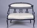 494 VICTORIAN CARVED AND EBONIZED WOOD LOVESEAT