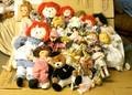 A Collection of Reproduction Dolls and Teddy Bears