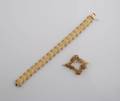A 14 Karat Yellow Gold Bracelet and Matching Pin