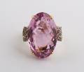 An 18 Karat Yellow Gold Kunzite and Diamond Ring