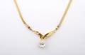A 14 Karat Yellow Gold and Diamond Necklace