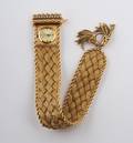 A 14 Karat Yellow Gold and Diamond Bracelet Watch Geneve