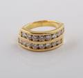 An 18 Karat Yellow Gold and Diamond Ring