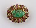 An 18 Karat Yellow Gold Ruby Diamond and Green Jadeite Brooch