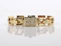 A Ladys 14 Karat Yellow Gold Wristwatch Tourneau