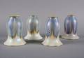 A Set of Four Quezal Glass Shades