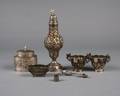 A Group of Seven Repousse Decorated Silver Objects