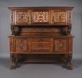 A Carved Walnut Sideboard