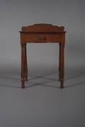 A Victorian Walnut Stand with Backboard