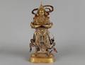 228 RARE AND LARGE GILT BRONZE FIGURE OF A GUARDIAN