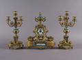 A Louis XV Style Porcelain and Bronze Three Piece Clock Garniture