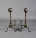 A Pair of Brass and Iron Andirons